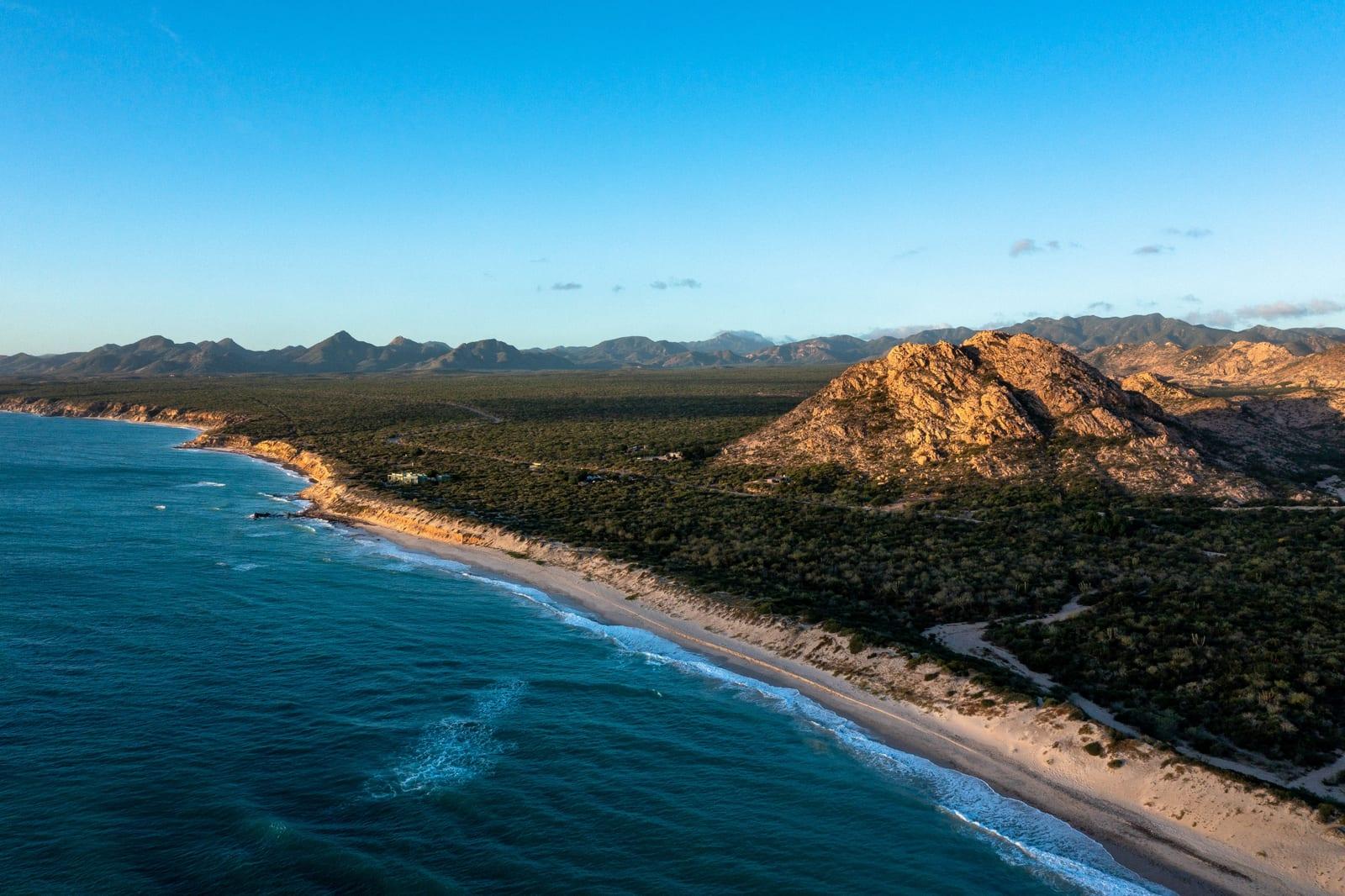Aerial view of Cabo Pulmo's rocky coastline and beach along the Sea of Cortez, Baja California Sur.