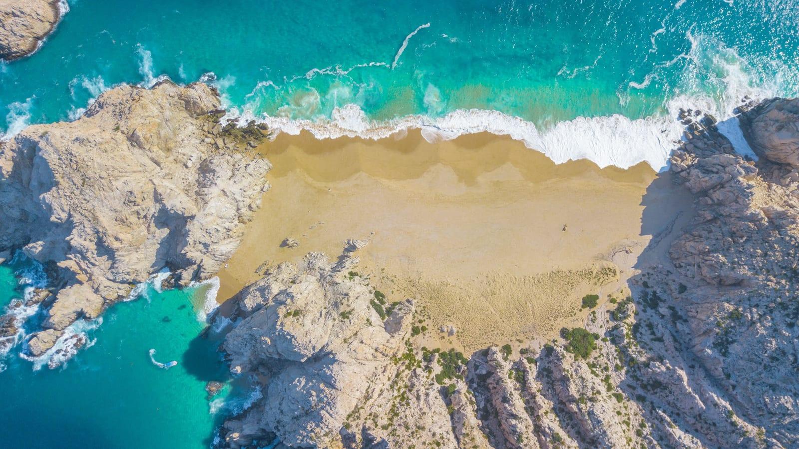 Aerial view of Playa del Divorcio (Divorce Beach), a secluded stretch of sand near Land's End, Cabo San Lucas.