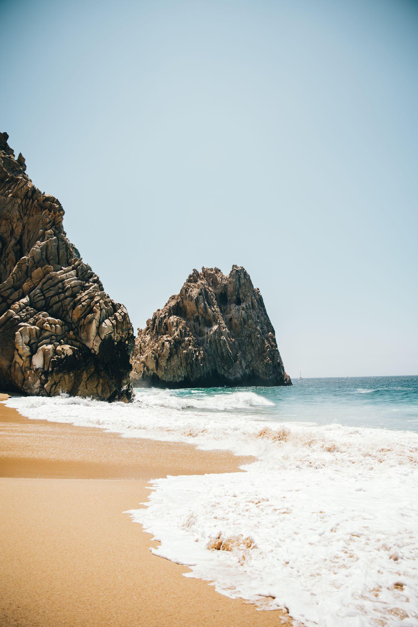 Sandy beach with rock formations along the Cabo San Lucas coastline